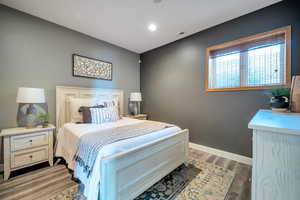 Bedroom featuring light wood-type flooring and recessed lighting