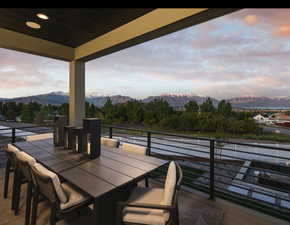 View of patio featuring a mountain view and outdoor dining space