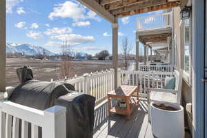 Deck featuring a beautiful view of the Wasatch front,  large enough for BBQing, or relaxing with a good book, relaxing on some comfortable outdoor furniture.