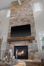 22 ft  floor to ceiling natural Stone fireplace with custom mantel and hearth