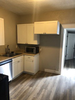 1 bedroom kitchen. It has a refrigerator