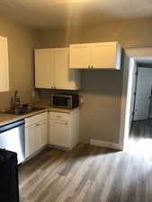 1 bedroom kitchen. It has a refrigerator