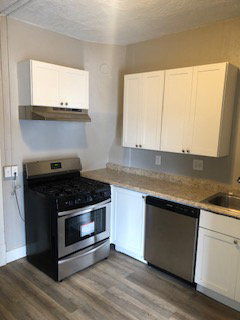 1 bedroom kitchen. It has a refrigerator