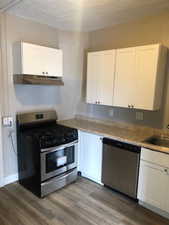 1 bedroom kitchen. It has a refrigerator