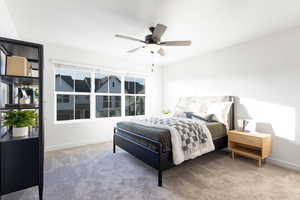 Bedroom with light carpet and ceiling fan