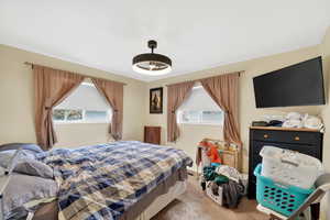 Bedroom featuring carpet flooring