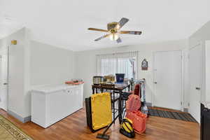 Spacious dining area with sliding door and garage access