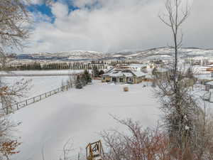 Bird's eye view of this 1.25 acre property. Stunning VIEWS! Gorgeous Rambler/Ranch home. Massive detached garage/shop. Beautiful Landscaping. Mature Trees. VIEWS!