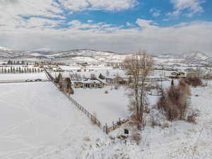 Bird's eye view of this 1.25 acre property. Stunning VIEWS! Gorgeous Rambler/Ranch home. Massive detached garage/shop. Beautiful Landscaping. Mature Trees. VIEWS!