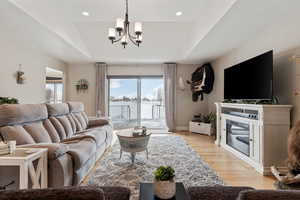 Main Level Living! High Quality 3/4" Hard wood flooring throughout main areas. Vaulted Ceilings. Can lights. Generous slider for abundant natural light. Slider open to trex deck.