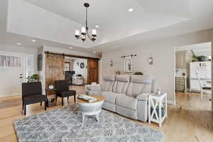 Main Level Living! High Quality 3/4" Hard wood flooring throughout main areas. Vaulted Ceilings. Can lights. Generous slider for abundant natural light. Opening to the right leads to dining and kitchen.