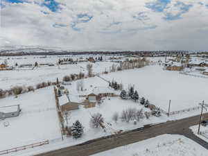 Bird's eye view of this 1.25 acre property. Stunning VIEWS! Gorgeous Rambler/Ranch home. Massive detached garage/shop. Beautiful Landscaping. Mature Trees. VIEWS!