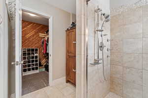 Main Level Living! Primary Bedroom. Beautiful slider leading to hot tub, and back deck. Primary Ensuite walk in closet. Enclosed Toilet room.