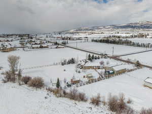 Bird's eye view of this 1.25 acre property. Stunning VIEWS! Gorgeous Rambler/Ranch home. Massive detached garage/shop. Beautiful Landscaping. Mature Trees. VIEWS!