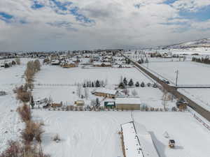 Bird's eye view of this 1.25 acre property. Stunning VIEWS! Gorgeous Rambler/Ranch home. Massive detached garage/shop. Beautiful Landscaping. Mature Trees. VIEWS!