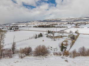 Bird's eye view of this 1.25 acre property. Stunning VIEWS! Gorgeous Rambler/Ranch home. Massive detached garage/shop. Beautiful Landscaping. Mature Trees. VIEWS!