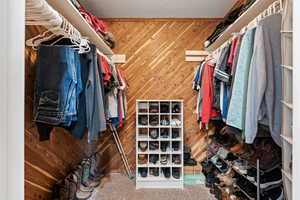 Main Level Living! Primary Bedroom. Beautiful slider leading to hot tub, and back deck. Primary Ensuite walk in closet. Enclosed Toilet room.