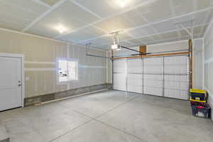 Garage featuring a garage door opener