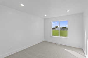 Unfurnished room featuring carpet and recessed lighting