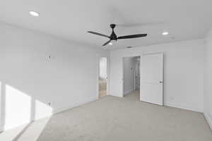 Unfurnished bedroom with carpet flooring, recessed lighting, connected bathroom, and a ceiling fan