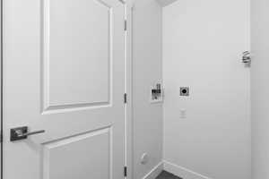 Laundry area featuring hookup for a washing machine and electric dryer hookup