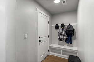 Mudroom featuring wood finished floors