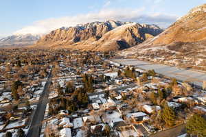 View of mountain backdrop featuring nearby suburban area