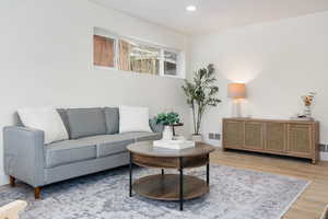 Living room featuring recessed lighting and wood finished floors