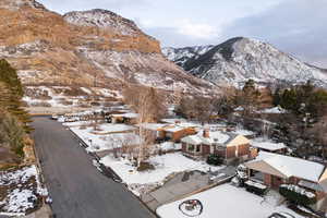 View of mountain backdrop featuring nearby suburban area
