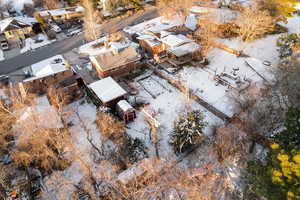 Snowy aerial view with a residential view