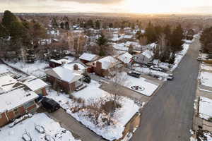 Snowy aerial view featuring a residential view