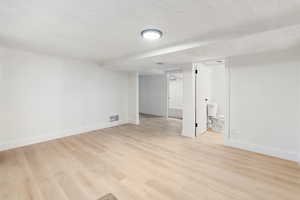 Finished basement with light wood-style floors