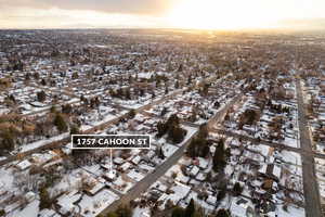 Snowy aerial view featuring a residential view