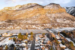 View of mountain backdrop featuring nearby suburban area