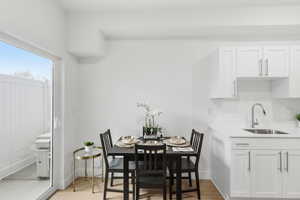 Dining space with light wood finished floors and baseboards