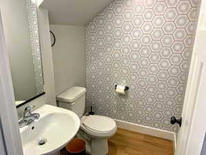 Bathroom featuring a sink and light wood-style floors