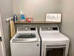 Laundry area with washer and clothes dryer