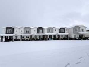 View of front facade featuring stone siding