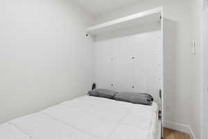 Plus one with wood finished floors and a closet