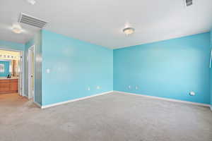 Spare room with carpet flooring and baseboards