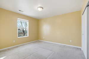 Bedroom with carpet floors and a closet