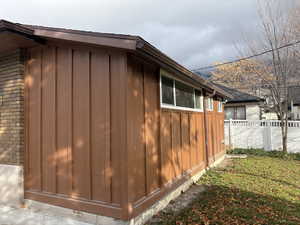 View of home's exterior featuring board and batten siding and brick siding