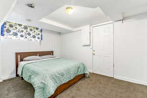 Bedroom featuring carpet floors and electric panel