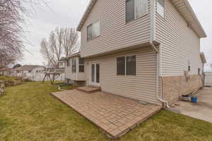 Back of house with a patio area