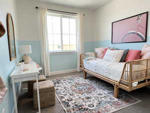 Carpeted bedroom with baseboards