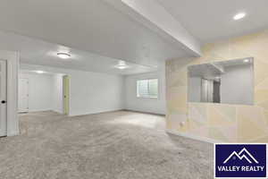 Below grade area with carpet and baseboards
