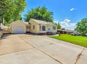 Ranch-style home with an attached garage and driveway