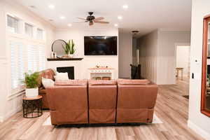 Open great room featuring a fireplace.