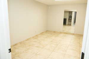 Large tiled room with endless possiblities. Is plumbed and was used as a hair salon.