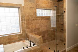 Master bathroom featuring garden tub and seperate walk in shower.